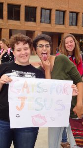 Protesters display a "Gays for Jesus" sign.