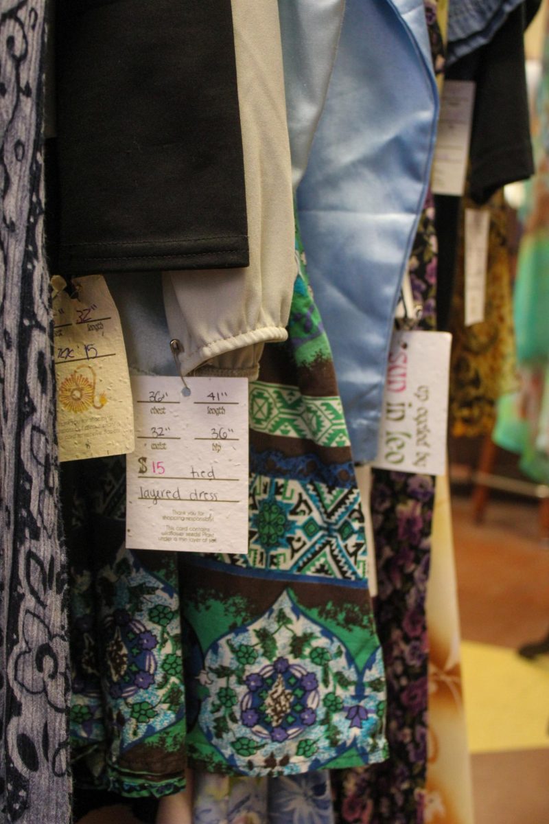 A curated clothing rack at Sun in Leo shows unique patterns and fabrics. 